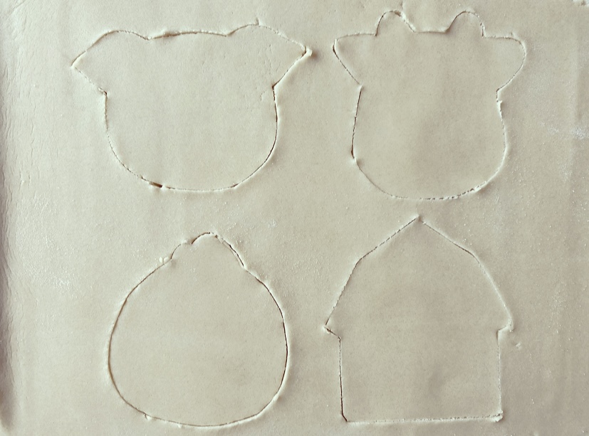 hand cutting sugar cookies